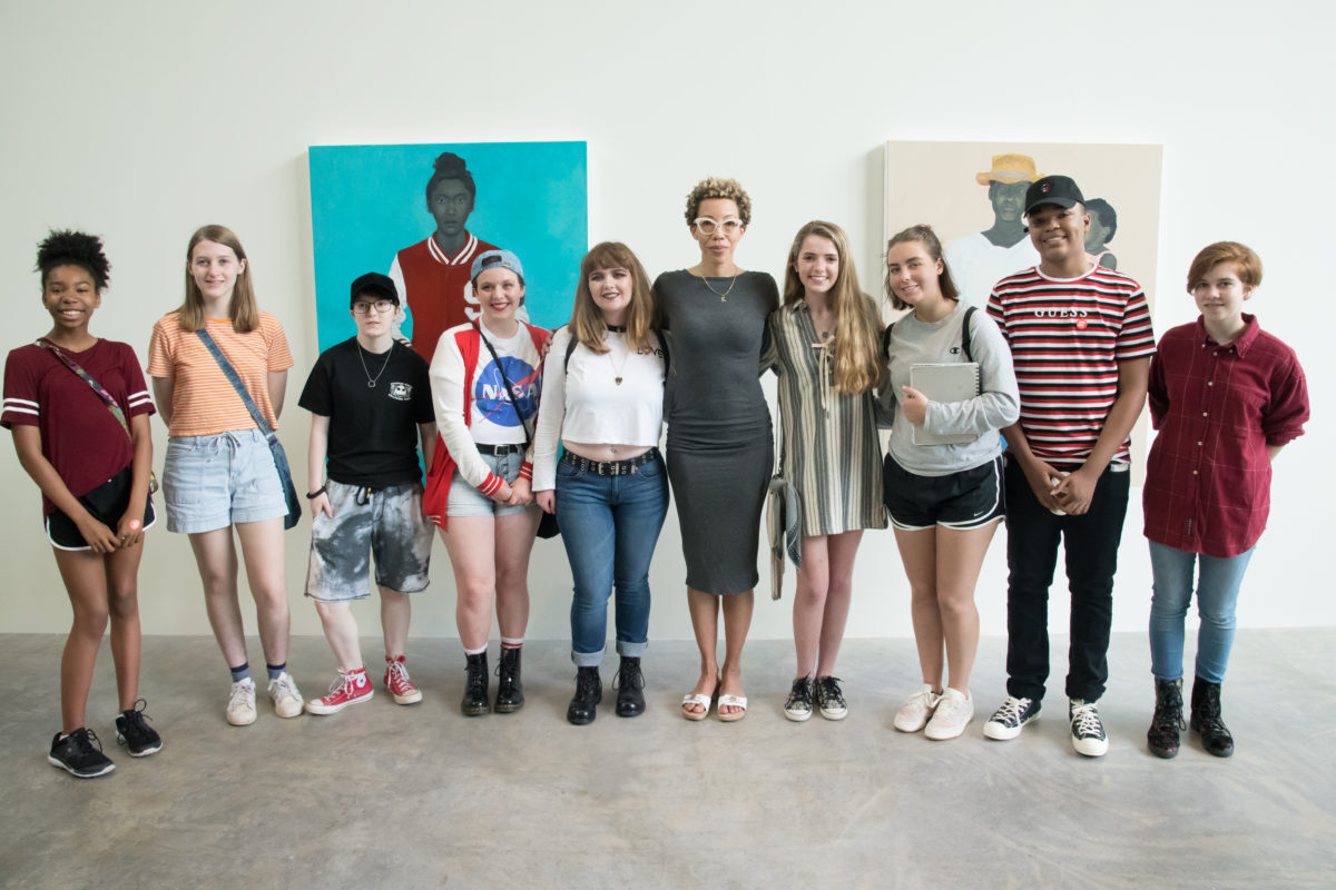Amy Sherald poses with New Art in the Neighborhood students. Photo: Jon Gitchoff.