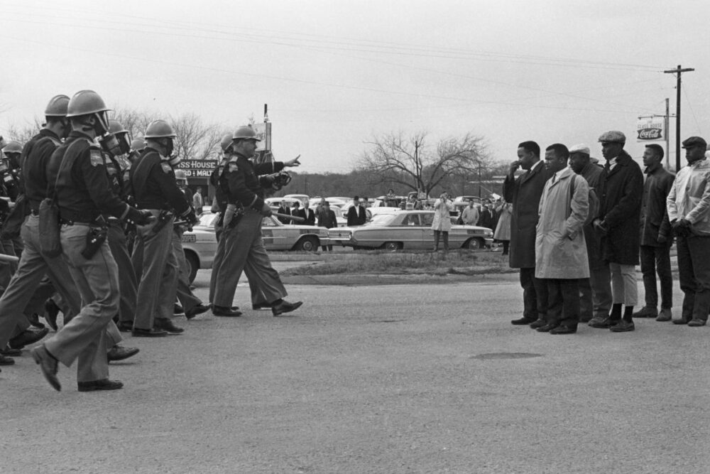 Protestors and police officers on Bloody Sunday, in <em>John Lewis: Good Trouble</em>, a Magnolia Pictures release. © Spider Martin. Photo courtesy Magnolia Pictures. 