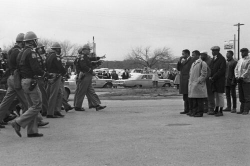 Protestors and police officers on Bloody Sunday, in <em>John Lewis: Good Trouble</em>, a Magnolia Pictures release. © Spider Martin. Photo courtesy Magnolia Pictures. 