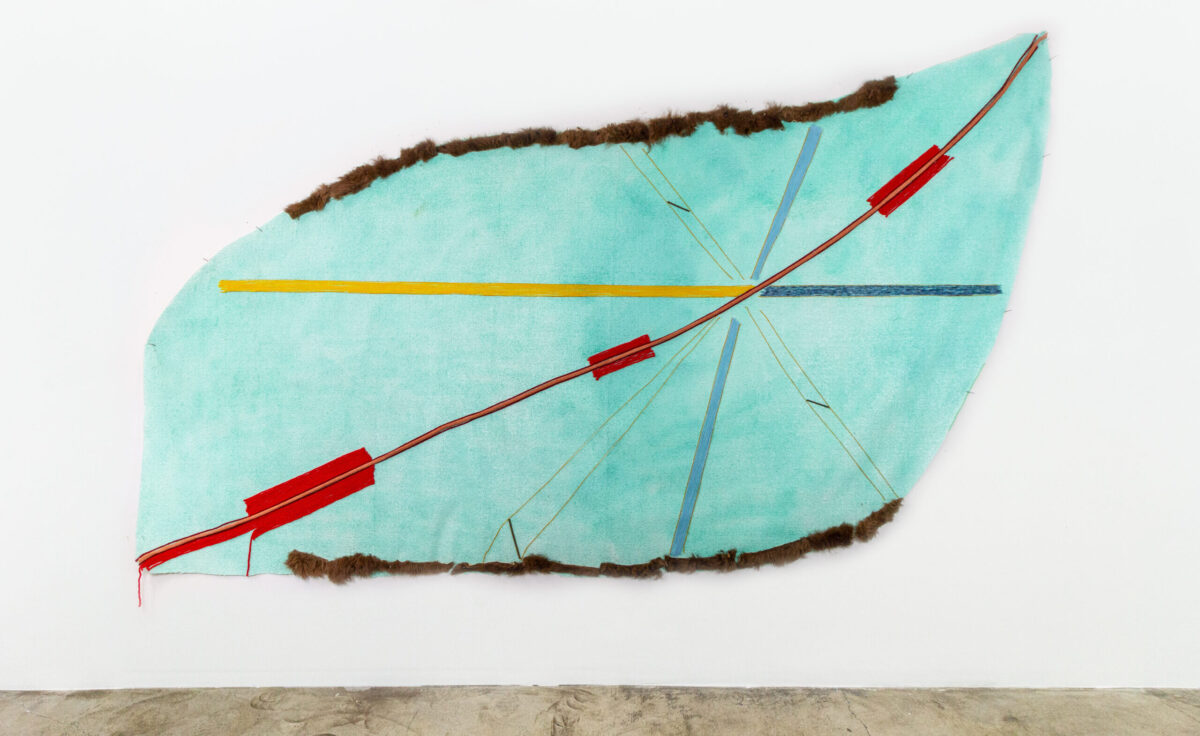 Teresa Baker, <em>Converging</em>, 2023. Spray paint, yarn, buffalo hide and willow on artificial turf. 67 1/2 x 114 inches. © Teresa Baker. Tia Collection. Image courtesy of the artist and de boer, Los Angeles, California; Photo: Jacob Phillip.